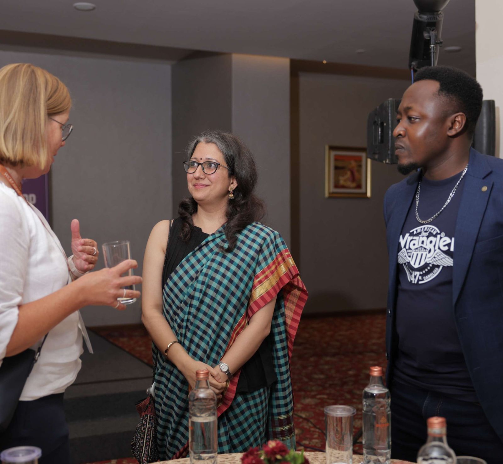 Guests in conversation during the Gandhinagar dinner